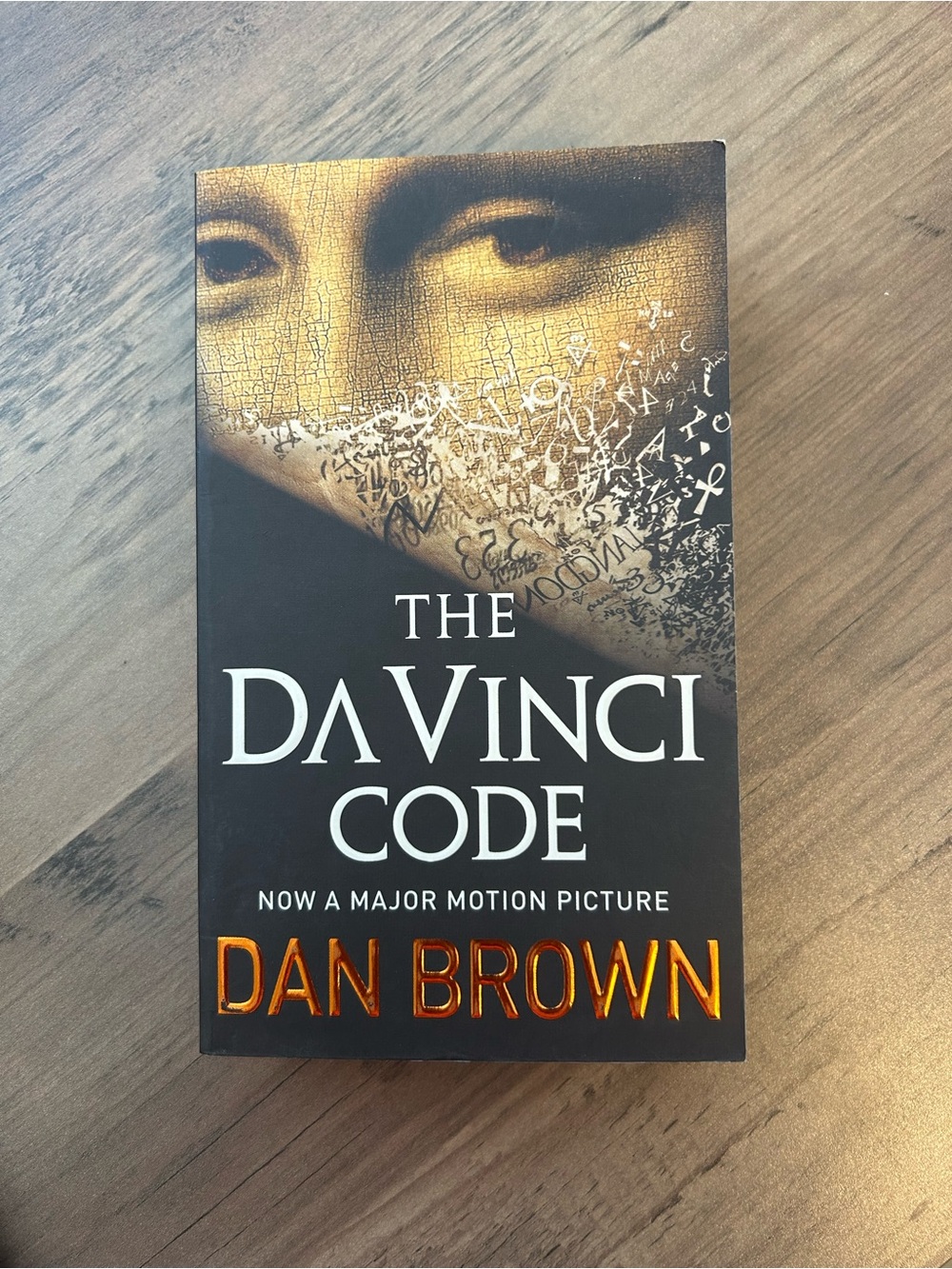 The Da Vinci Code by Dan Brown - Black and Gold Paperback Novel